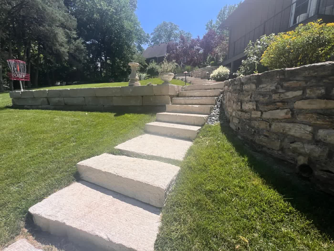 8-inch Drexel Cream steps with 12-inch Grindstone retaining wall