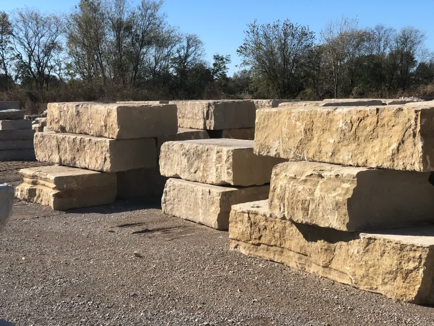 22-inch Drexel Cream retaining wall ledge stone stacked at yard