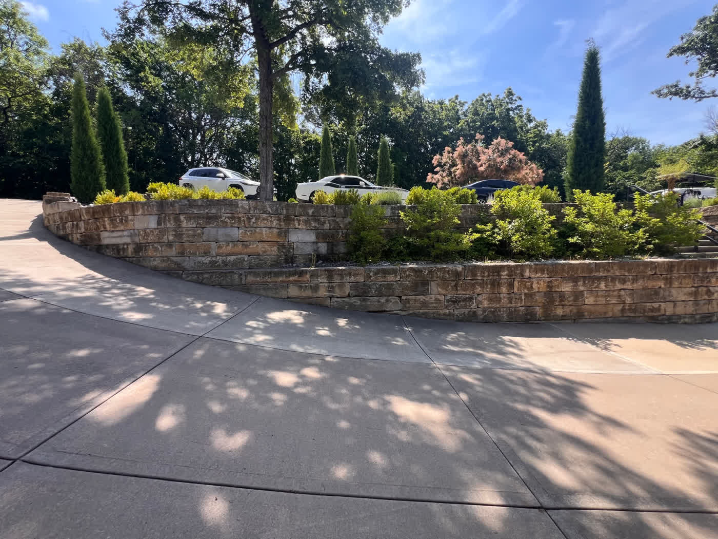 Natural stone retaining wall built on an Ozark hillside in Northwest Arkansas