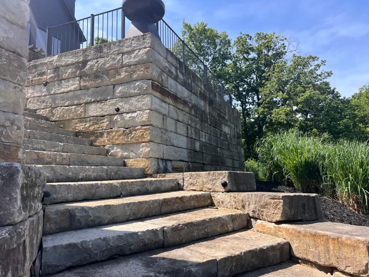 Boulder retaining wall installation in Bentonville, AR