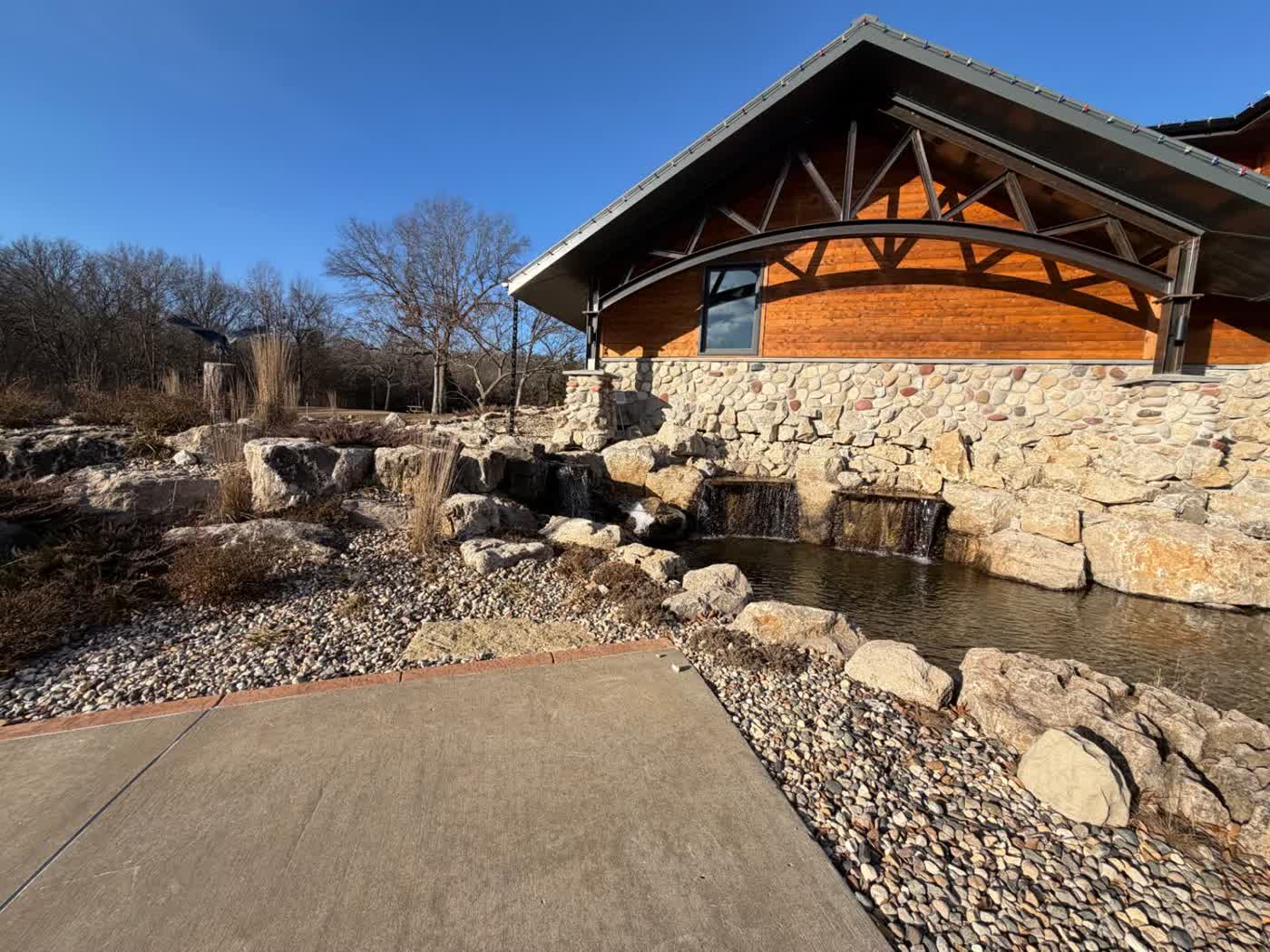Natural swim pond with stone edges