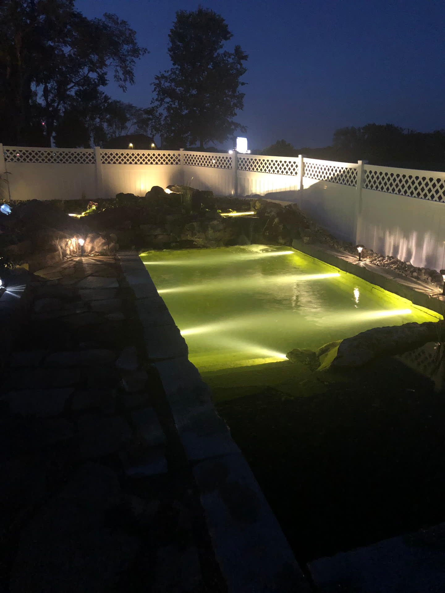 Swim pond with underwater lighting at night