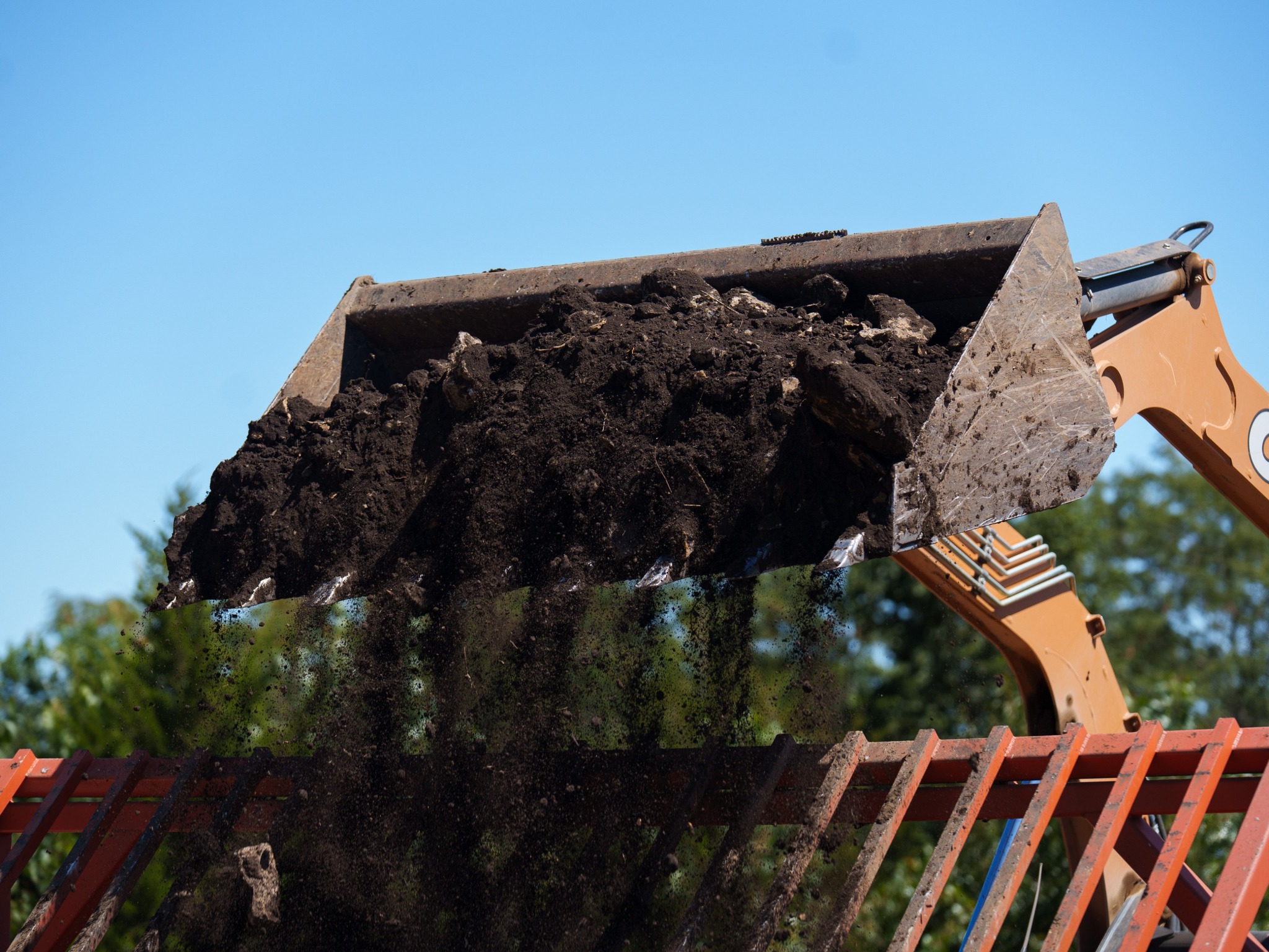 Professional land clearing equipment operated by Freedom Pondscapes